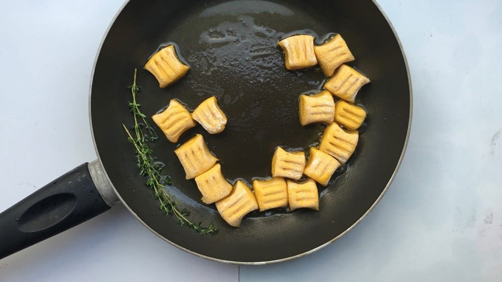 Crunchy pan seared pumpkin gnocchi with ricotta and parmesan cheese... This homemade gnocchi recipe is a great autumn side dish!