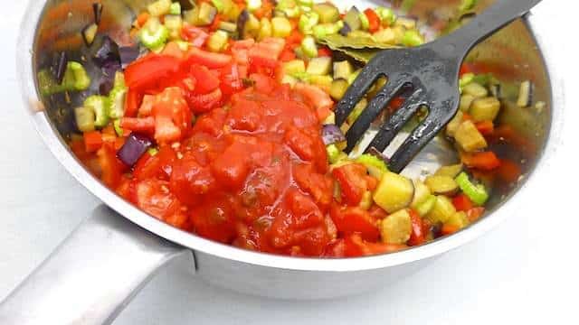 This caponata recipe is a sweet and sour Sicilian ratatouille made of eggplant, celery, tomatoes, bell pepper, capers and olives...