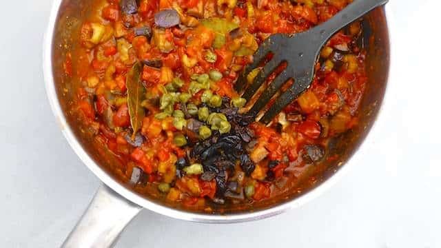 This caponata recipe is a sweet and sour Sicilian ratatouille made of eggplant, celery, tomatoes, bell pepper, capers and olives...