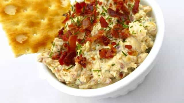 Easy Caramelized Onion Dip with Bacon This caramelized onion dip with crunchy bits of bacon and cream cheese in it is possibly the most hearty dip in the whole wide world!