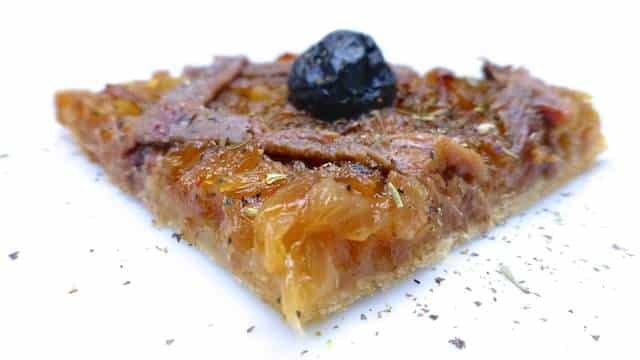 French pissaladiere, a caramelized onion pizza with black olives and salted anchovies from the mediterranean city of Nice!