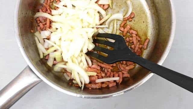 Succulent baked pork chops in beer sauce with crunchy bacon bits and soft onion... No need to say how fantastic this recipe tastes!