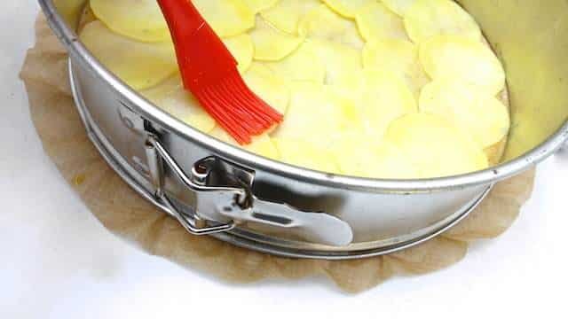 A classic French potato galette recipe: crunchy scalloped potatoes on top, buttery soft and smooth potatoes underneath...