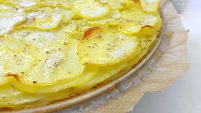 A classic French potato galette recipe: crunchy scalloped potatoes on top, buttery soft and smooth potatoes underneath...