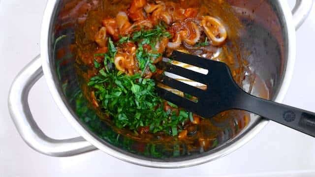 My delicious fresh squid spaghetti recipe with fresh tomatoes, black olives and basil... This is a splendid mediterranean pasta dish!