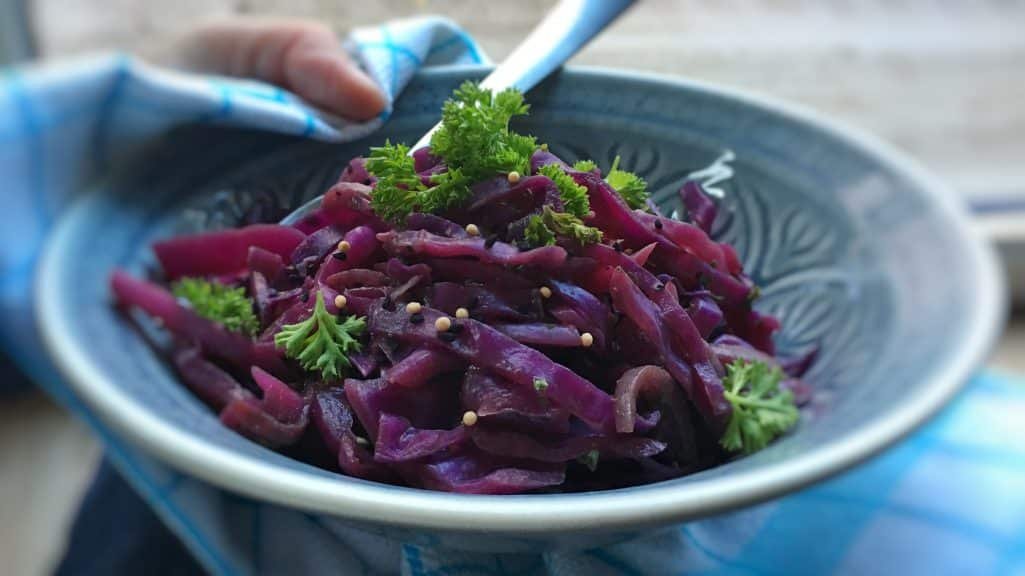 Sliced red cabbage in flavorful kriek beer: what an amazing flavor match this is! Try out this braised red cabbage recipe...