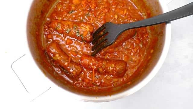 Braciole di manzo, juicy Italian stuffed beef rolls with olives, eggs, ham and basil! Braised in a chunky tomato sauce...