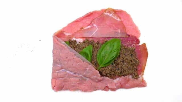 Braciole di manzo, juicy Italian stuffed beef rolls with olives, eggs, ham and basil! Braised in a chunky tomato sauce...