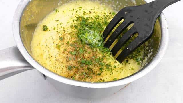 Try this very easy grilled polenta: with pine nuts, black olives and grated parmesan cheese... Serve it as a light lunch or a veggie side dish!