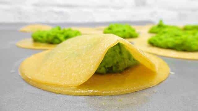 My homemade ravioli recipe: a fresh ravioli recipe with peas and a surprising fresh twist of mint. Learn how to make fresh pasta!