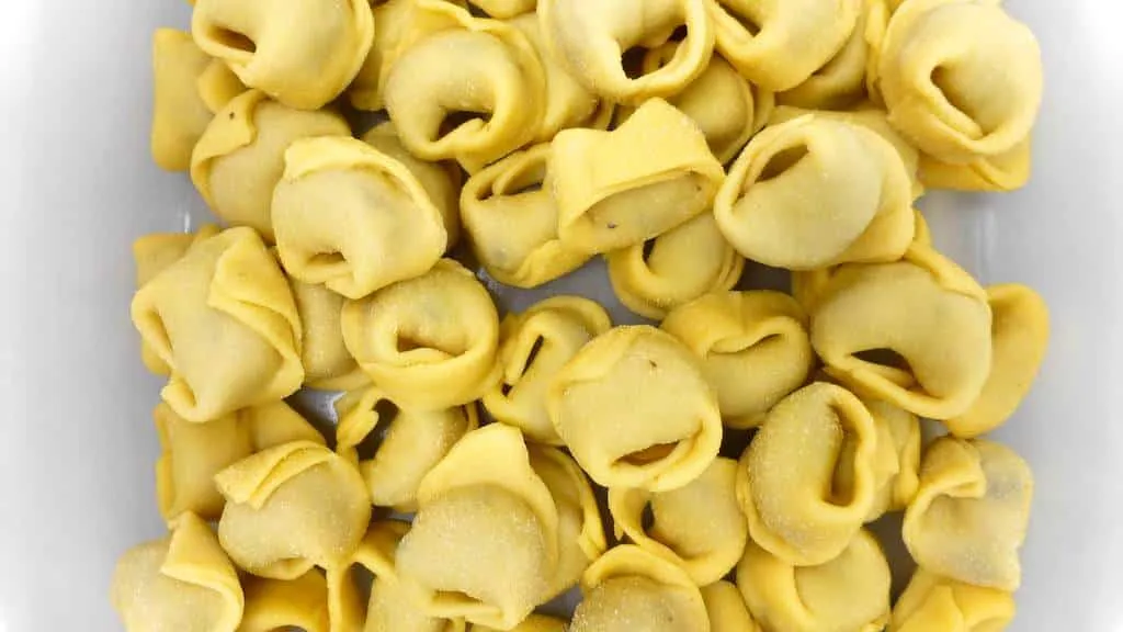 How To Make Tortellini the Easy Way How to make tortellini from scratch: a step-by-step picture guide to show you how to fold fresh tortellini the right way!