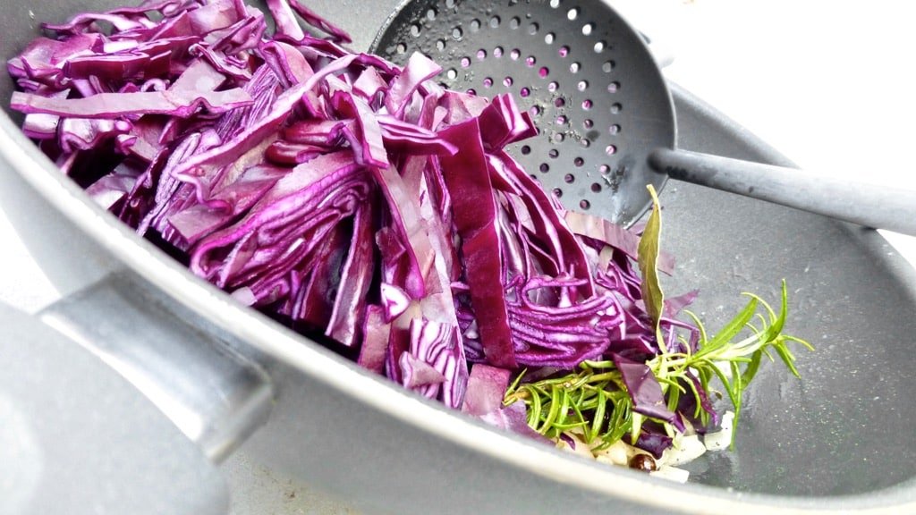 Sliced red cabbage in flavorful kriek beer: what an amazing flavor match this is! Try out this braised red cabbage recipe...