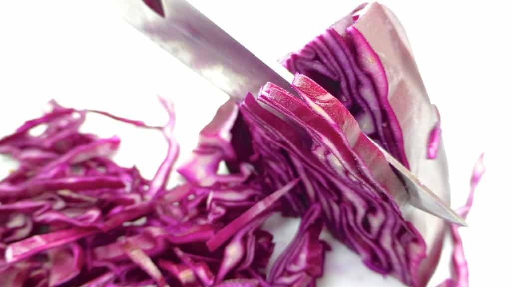Sliced red cabbage in flavorful kriek beer: what an amazing flavor match this is! Try out this braised red cabbage recipe...