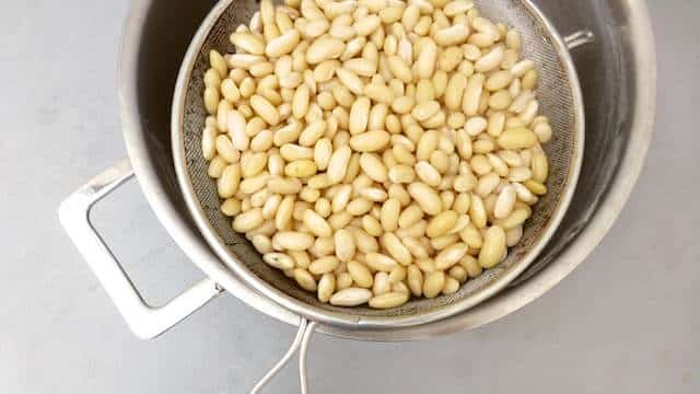 Less is truly more... how about these lukewarm braised Italian white beans in lots of olive oil, my favorite white beans recipe ever!
