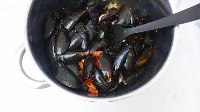 My delicious mussels provencal recipe with fresh tomatoes, black olives, capers, garlic and white wine... Awesome summer meal!