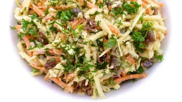 Parsnip slaw with grated carrots, mayo and raisins! I love parsnips: they are so flavorful and a tad sweet, probably one of my favorite winter vegetables!