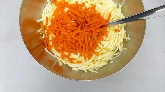 Parsnip slaw with grated carrots, mayo and raisins! I love parsnips: they are so flavorful and a tad sweet, probably one of my favorite winter vegetables!