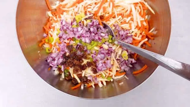 Parsnip slaw with grated carrots, mayo and raisins! I love parsnips: they are so flavorful and a tad sweet, probably one of my favorite winter vegetables!