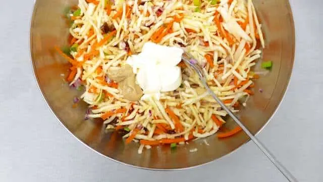 Parsnip slaw with grated carrots, mayo and raisins! I love parsnips: they are so flavorful and a tad sweet, probably one of my favorite winter vegetables!