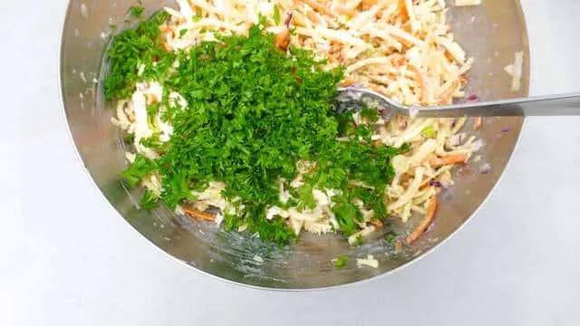 Parsnip slaw with grated carrots, mayo and raisins! I love parsnips: they are so flavorful and a tad sweet, probably one of my favorite winter vegetables!