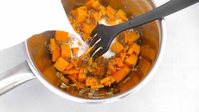 Coconut kale and pumpkin bisque, a hearty autumn soup! This pumpkin bisque is based on a stunning Nyonya dish I tasted in Penang (Malaysia).