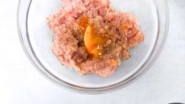 I love veal parmigiana so how about veal burgers parmigiana with mozzarella in a homemade tomato sauce? Pepper, salt, dried herbs - keep it simple.