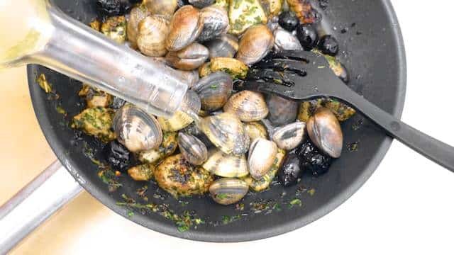 Porco a Alentejana, a popular Portuguese dish with pork and clams! Mixing meat and fish or seafood is quite popular in Portuguese cuisine.