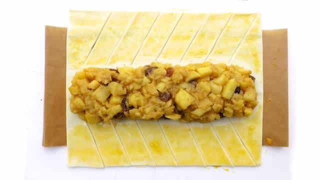 Learn to make a simple classic puff pastry braid filled with sweet apples and raisins! You will love my apple strudel recipe...