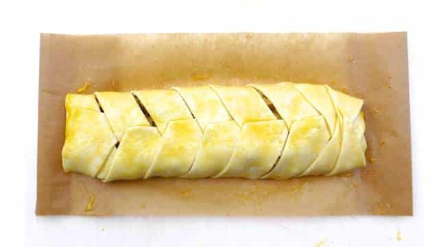 Learn to make a simple classic puff pastry braid filled with sweet apples and raisins! You will love my apple strudel recipe...