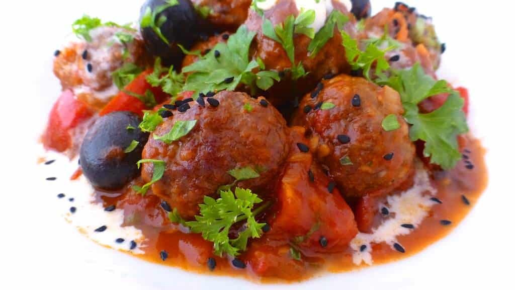 My spiced garam masala meatballs in a tangy tomato and lemon sauce drizzled with yogurt, the perfect lamb meatball curry...