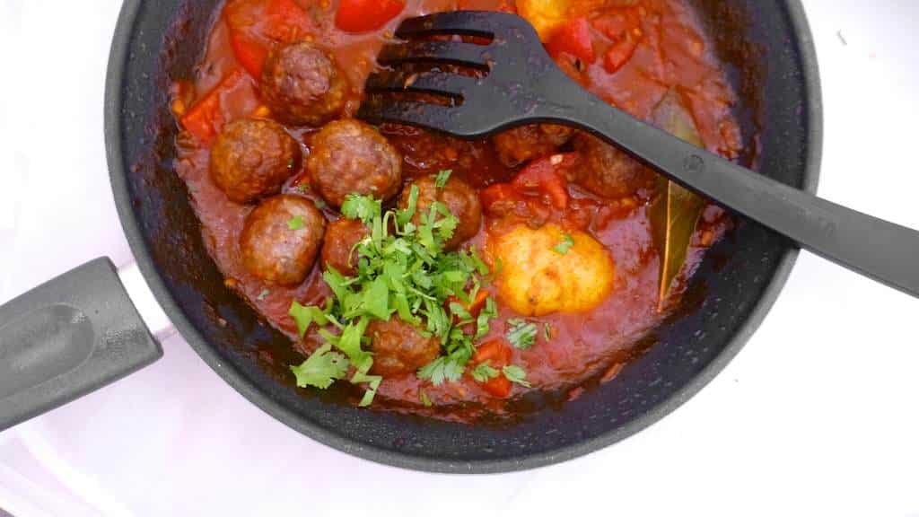 My spiced garam masala meatballs in a tangy tomato and lemon sauce drizzled with yogurt, the perfect lamb meatball curry...