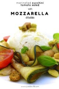 Easy Zucchini Tomato Mozzarella Salad Mozzarella di bufala, cherry tomatoes and marinated zucchini with pine nuts, fresh basil and herbed croutons: a tasty zucchini tomato mozzarella salad!