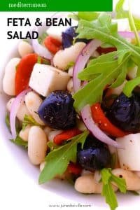 Easy Bean And Feta Salad with Lemon Dressing A great summer bean and feta salad packed with black olives, piquillo peppers, fresh arugula and a zesty lemon juice dressing!