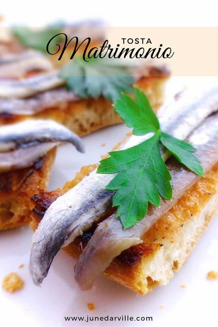 Crunchy Spanish tosta matrimonio or pickled anchovies and salted anchovies on a slice of pan con tomate, the perfect wedding!