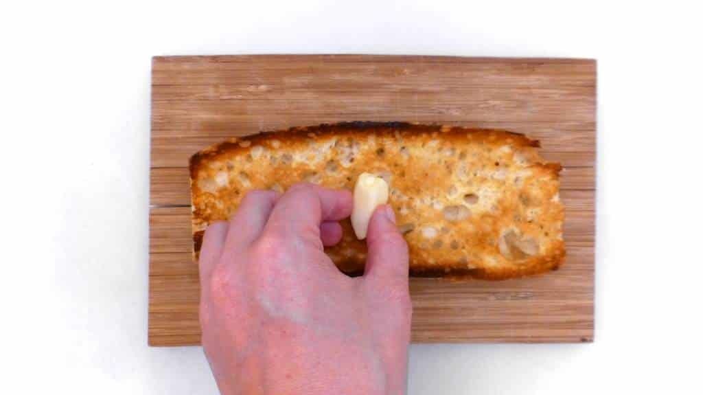 Crunchy Spanish tosta matrimonio or pickled anchovies and salted anchovies on a slice of pan con tomate, the perfect wedding!