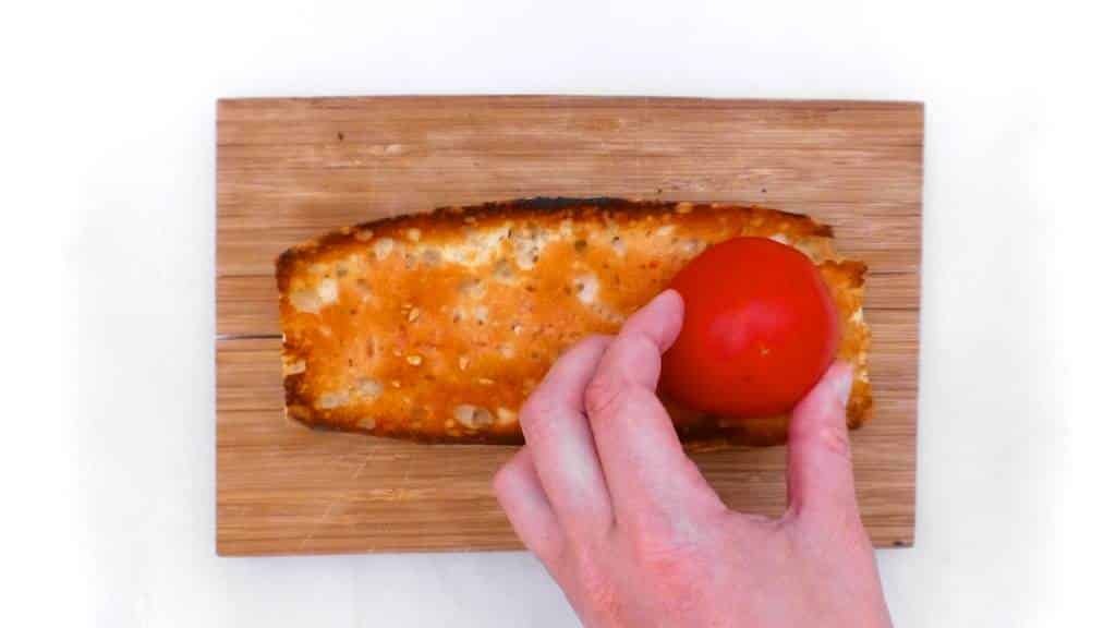 Crunchy Spanish tosta matrimonio or pickled anchovies and salted anchovies on a slice of pan con tomate, the perfect wedding!