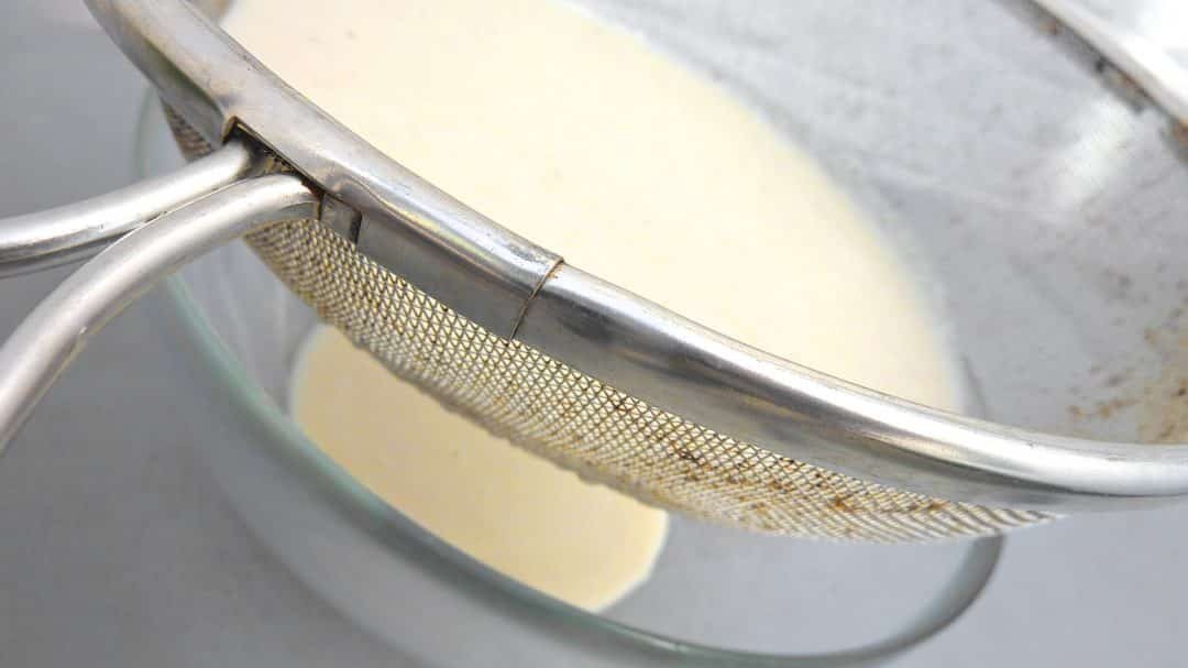 A creamy Spanish cold almond soup with sweet grapes that contains bread, garlic and almonds... also known as 'ajo blanco'.