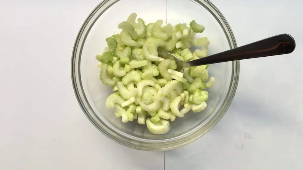Easy Fresh Apple Celery Salad Recipe What a fancy looking apple and celery salad this is! Look at that delicious homemade creamy blue cheese dressing drizzled on top, epic!