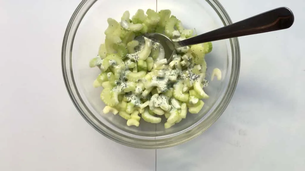 Easy Fresh Apple Celery Salad Recipe What a fancy looking apple and celery salad this is! Look at that delicious homemade creamy blue cheese dressing drizzled on top, epic!