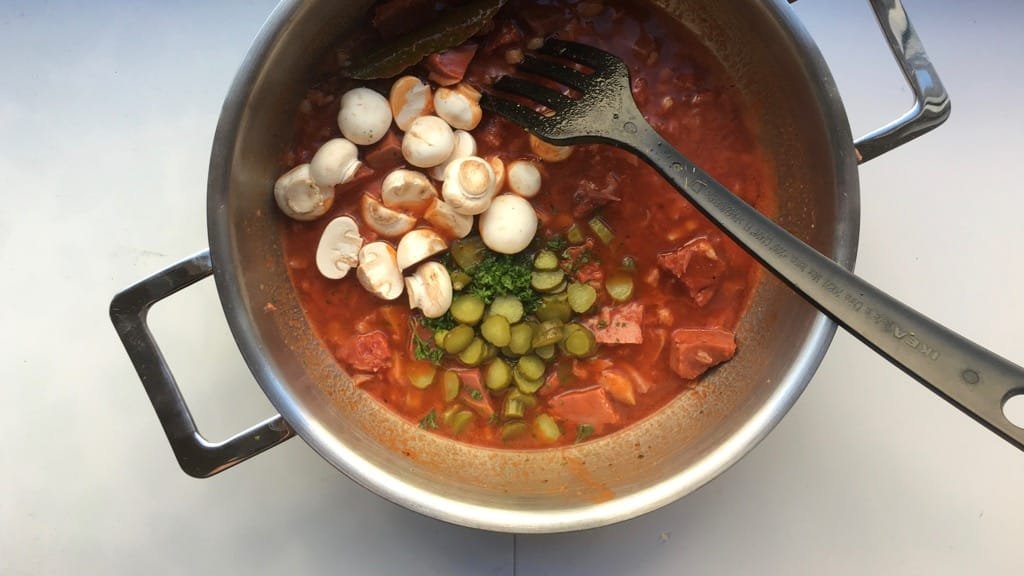 Main ingredients in this classic veal stew (veau en tortue in French): veal head, madeira wine, tomatoes, mushrooms and pickled gherkins.