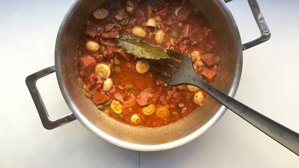 Main ingredients in this classic veal stew (veau en tortue in French): veal head, madeira wine, tomatoes, mushrooms and pickled gherkins.