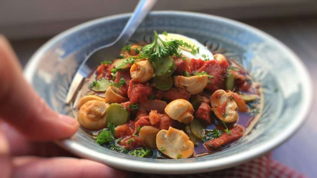 Main ingredients in this classic veal stew (veau en tortue in French): veal head, madeira wine, tomatoes, mushrooms and pickled gherkins.