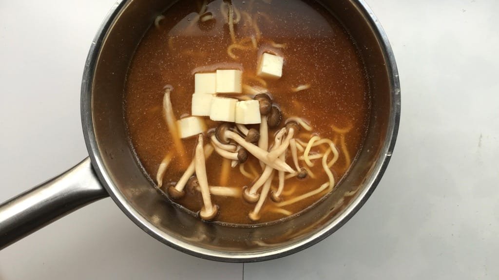 Noodles, miso broth, mushrooms, spring onion, tofu and a creamy soft-boiled egg; you can make this simple Japanese miso ramen at home!