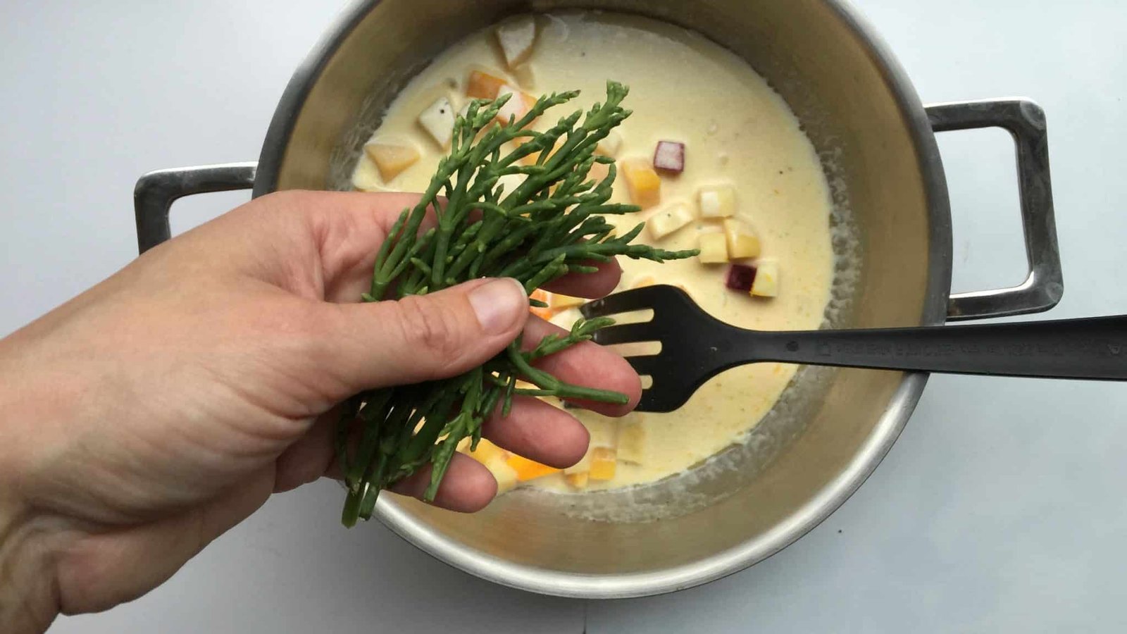 Steamed cod in a creamy winter vegetable navarin “de la mer”, a lighter fish version of the classic French lamb navarin stew!