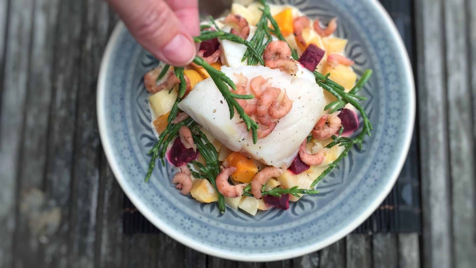 Steamed cod in a creamy winter vegetable navarin “de la mer”, a lighter fish version of the classic French lamb navarin stew!