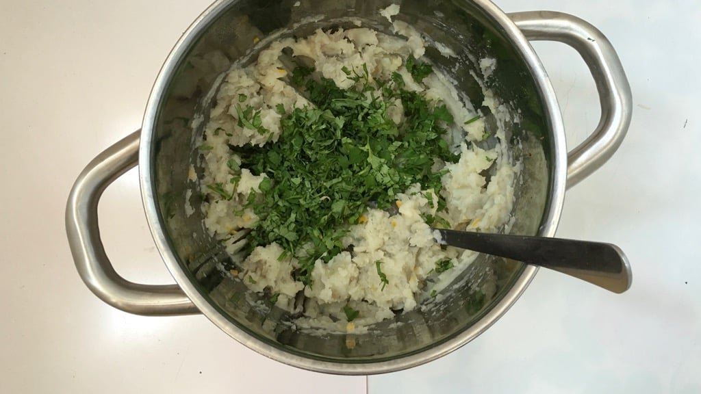 A handful of fresh cilantro, some grated orange zest and a knob of butter... this white sweet potato mash is a savory flavor bomb!