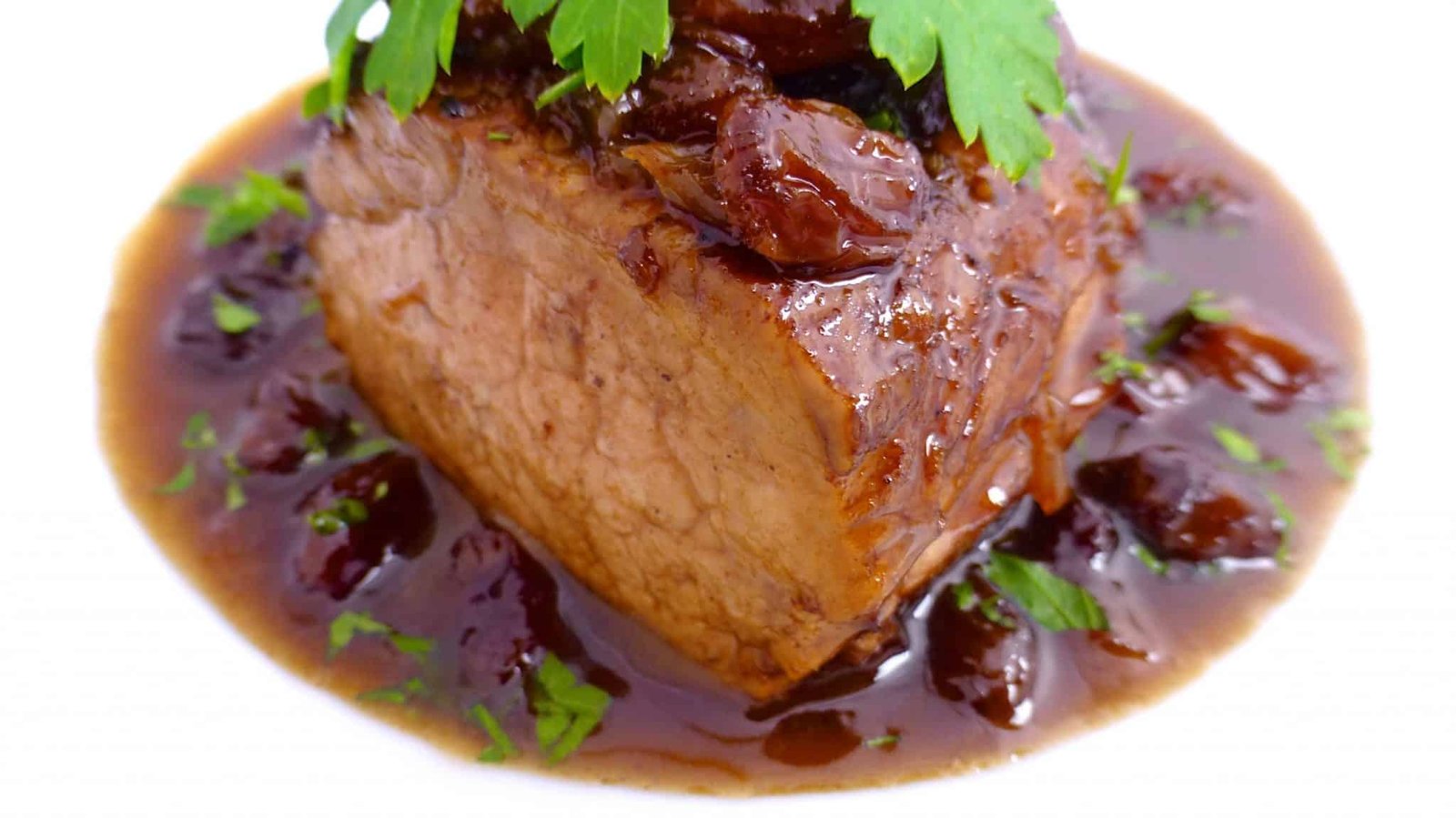 Solomillo al Pedro Ximenez, or pork tenderloin in a sweet reduction sauce with raisins... A delicious Spanish classic pork recipe!