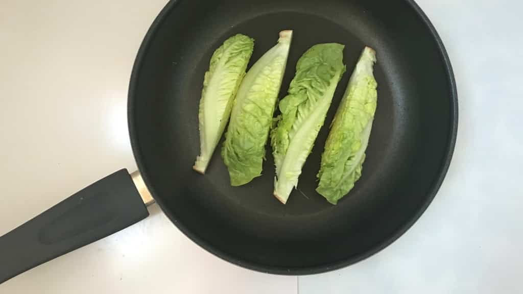 Delicious grilled romaine lettuce with grated parmesan cheese and olive oil, a surprising vegetable side dish for chicken or pork!