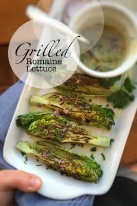 Delicious grilled romaine lettuce with grated parmesan cheese and olive oil, a surprising vegetable side dish for chicken or pork!