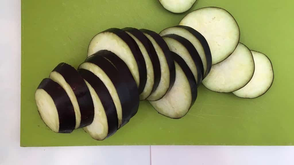 This refreshing and soothing eggplant in yogurt sauce is a great side dish to serve with your next spicy Indian curry dinner!